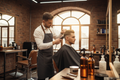 Professional barber giving a stylish men's haircut in a modern barbershop